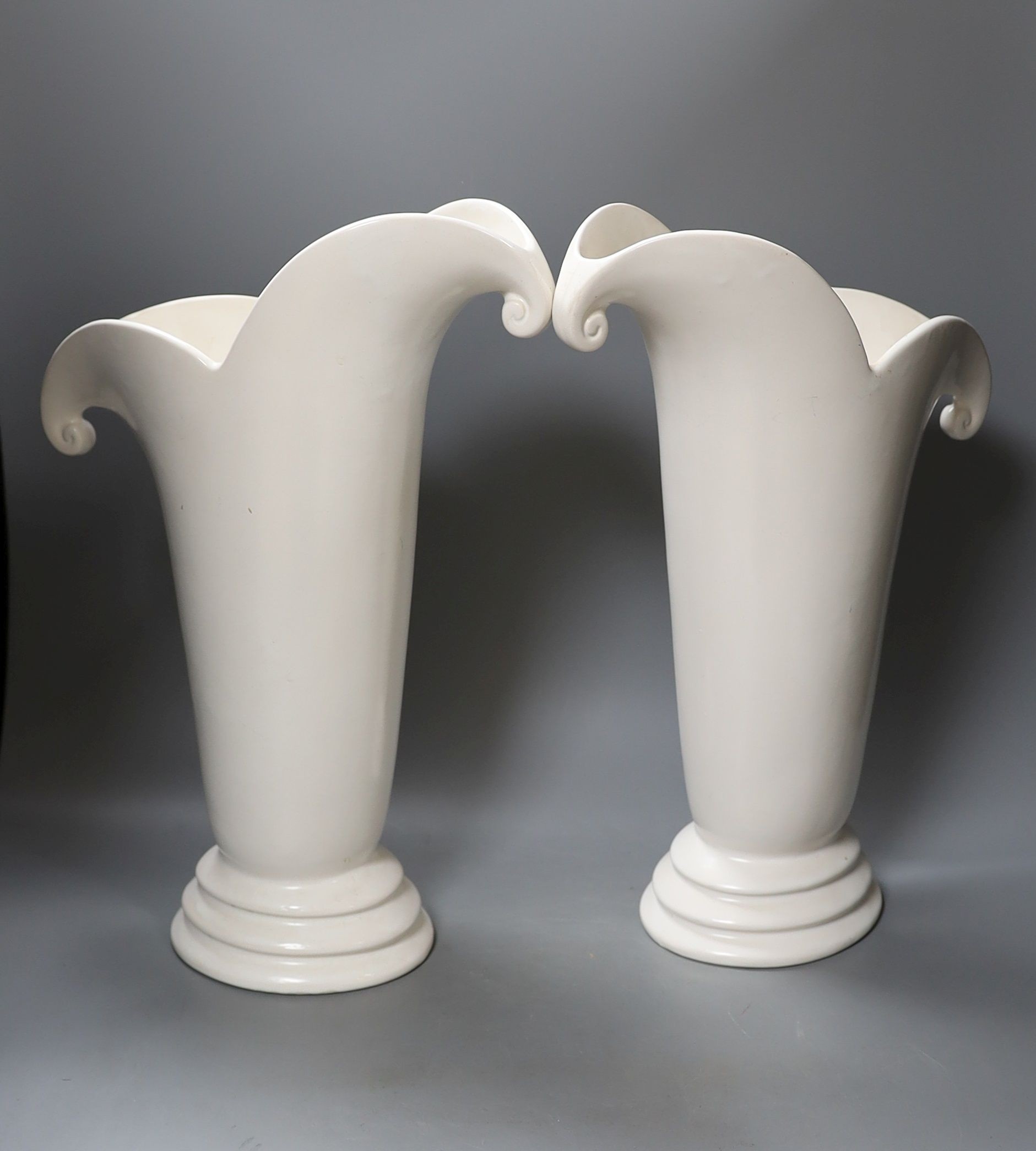 A large pair of Art Deco pottery vases, 41cm